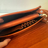 Close-up look of the inside of our Western Style leather crossbody bags. This one is Camel. It shows the pockets and details of this bag.