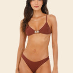 woman wearing a brown bikini available at EVAMAIA boutique.