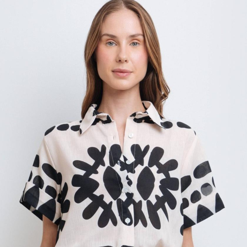 Model wearing a stylish black and white abstract print shirt made from high-quality polyester with a linen-like feel