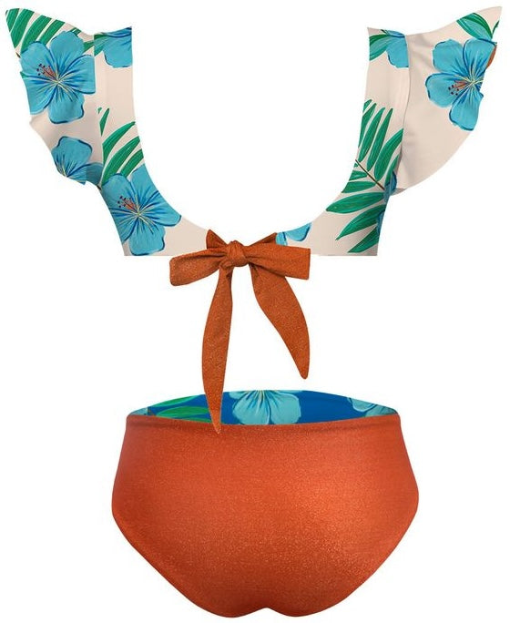 Tropical-themed bikini set with floral top and orange bottom on a white background