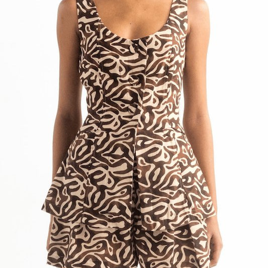 Model waring the Encantadore high waist shorts and vest in a brown color. 