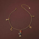 Necklace with various charms on a brown background