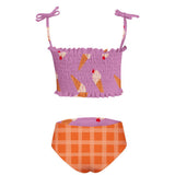 Purple ice cream themed two piece swimsuit for girls. Has an adjustable spagetti strap for the top. The swimsuit is shown over a white background. The bottom is reversible and has a waffle cone pattern.