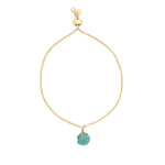 Image of a gold chain bracelet with a turquoise stone on it.The purpose of the image is to highlight the bracelet because it is on sale at EVAMAIA boutique in Studio City, CA.