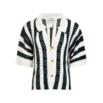 Black and white striped shirt with gold buttons on a white background.