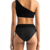 Back of a model wearing the Leonor Bikini top and the Leo bikini bottom by Encantadore Swimwear.