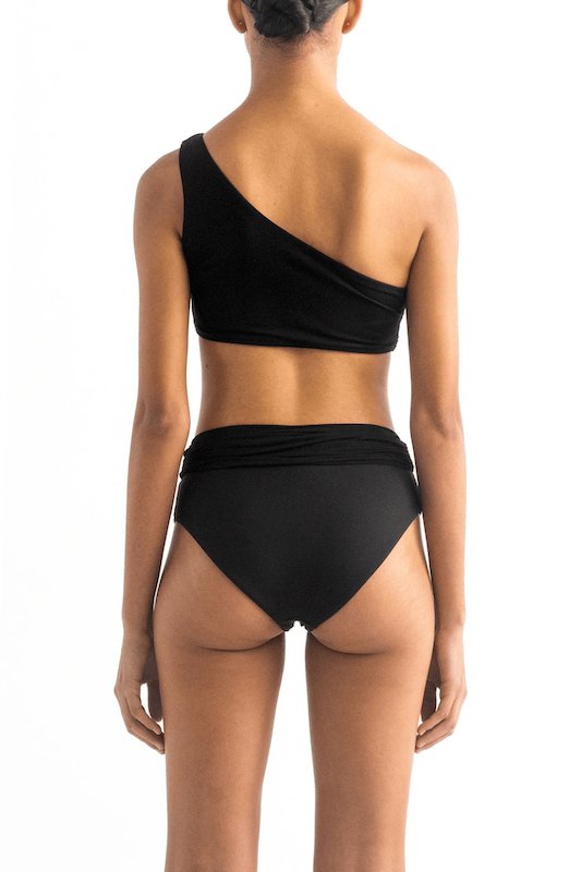 Back of a model wearing the Leonor Bikini top and the Leo bikini bottom by Encantadore Swimwear.