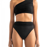 Front of a model wearing the Leonor bikini top and Leo bottom by Encantadore Swimwear.