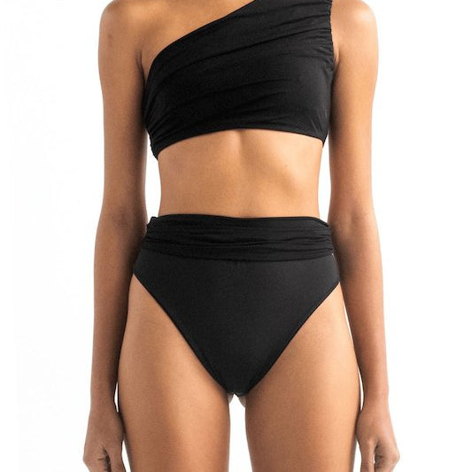 Front of a model wearing the Leonor bikini top and Leo bottom by Encantadore Swimwear.