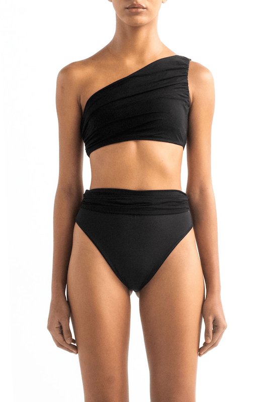 Front of a model wearing the Leonor bikini top and Leo bottom by Encantadore Swimwear.