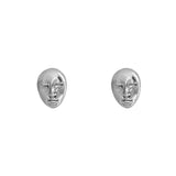 Image of a set of stud earrings of a face in Silver. It's set against a white background. The purpose of this image is to highlight the earrings by Pajarolimon Jewelry.