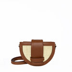 Brown crossbody bag with woven design on a white background. 