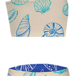 Two-piece swimsuit with shell pattern on a beige background