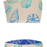 Two-piece swimsuit with shell pattern on a beige background