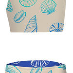 Two-piece swimsuit with shell pattern on a beige background
