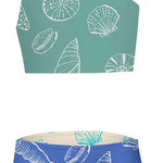 Two-piece swimsuit with shell pattern on teal top and blue bottom against a white background