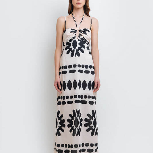 Model wearing a stylish black and white abstract print dress made from high-quality polyester with a linen-like feel