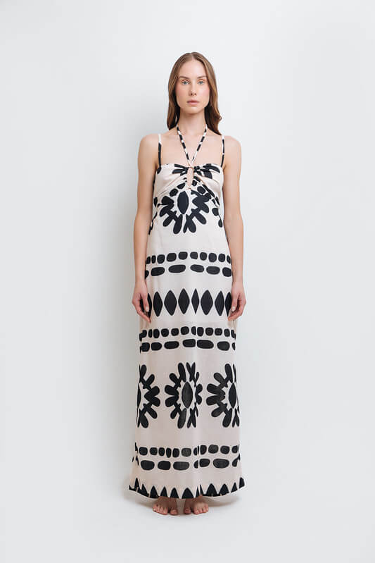 Model wearing a stylish black and white abstract print dress made from high-quality polyester with a linen-like feel