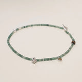 Green quartz beaded necklace with citrine, pearl, and tiger's eye accents in sterling silver