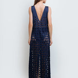 Back of a woman wearing Noa Navy Blue Maxi Dress by Mar de Lua with intricate cut-out design. Made in Colombia, available at EVAMAIA Boutique, Studio City, Los Angeles, CA.