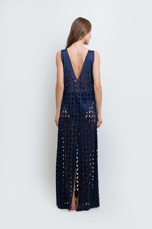 Back of a woman wearing Noa Navy Blue Maxi Dress by Mar de Lua with intricate cut-out design. Made in Colombia, available at EVAMAIA Boutique, Studio City, Los Angeles, CA.
