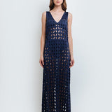 Woman wearing Noa Navy Blue Maxi Dress by Mar de Lua with intricate cut-out design. Made in Colombia, available at EVAMAIA Boutique, Studio City, Los Angeles, CA.