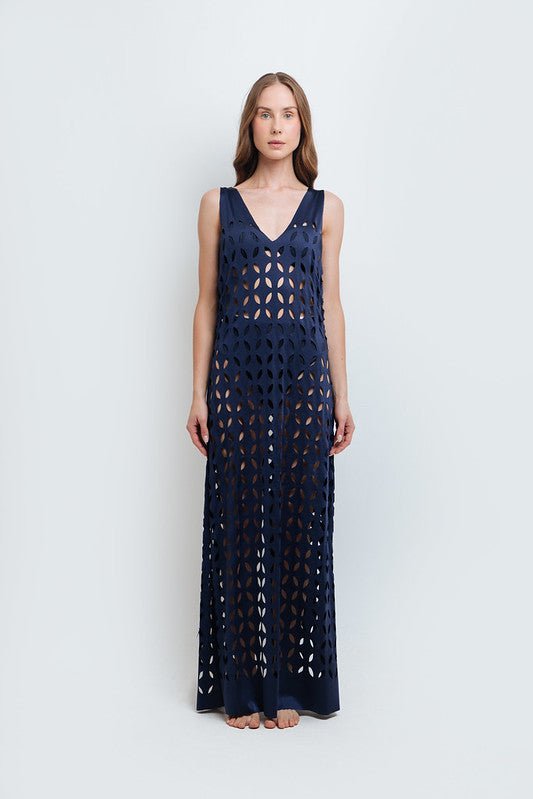Woman wearing Noa Navy Blue Maxi Dress by Mar de Lua with intricate cut-out design. Made in Colombia, available at EVAMAIA Boutique, Studio City, Los Angeles, CA.