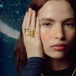 Image of a woman wearing two oversized rings. The purpose of this image is to highlight the Pajarolimon jewelry because it is for sale at EVAMAIA Boutique in Studio City, CA.