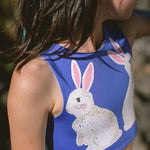 Children's blue bathing suit top with rabbit design.