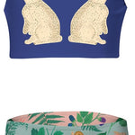 Two-piece girl's swimsuit with rabbit design on top and nature-themed bottom on a white background.