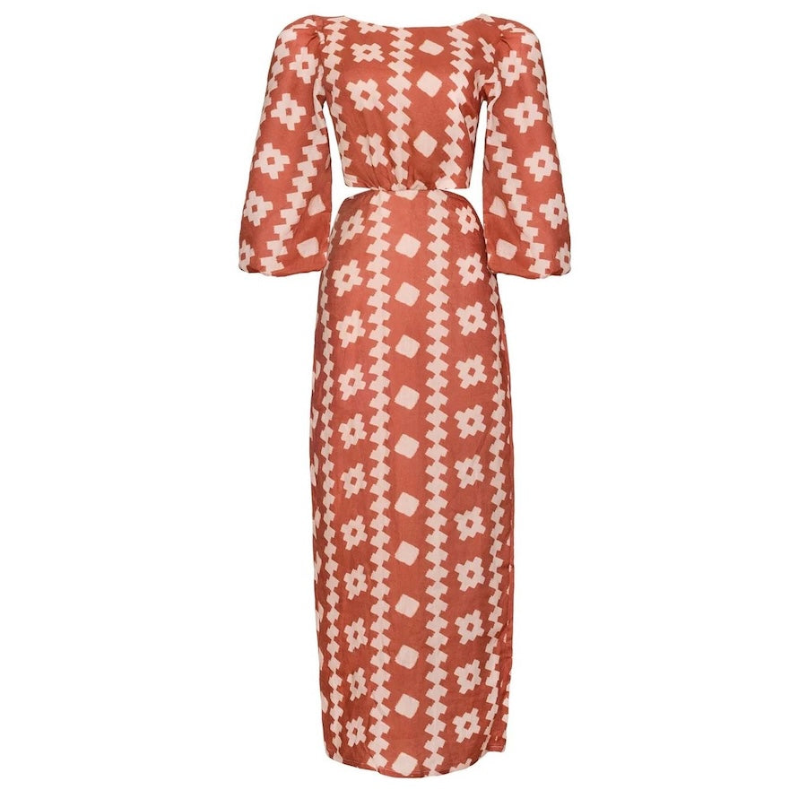 A long, patterned maxi dress in red and peach, with wide sleeves and elastic cuffs.