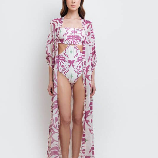 Image of a woman wearing a white and pink semi sheer kimono. The purpose of this image is to highlight the clothing because it's available for sale at EVAMAIA boutique in Studio City, CA.