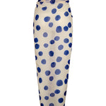 Image of a white sarong with blue polka dots. It's tied as it would be on a body. It's against a white background. The purpose of this image is to highlight the sarong, which is on sale at EVAMAIA boutique in Studio City.