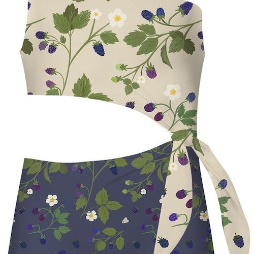 Girls one-piece swimsuit with floral pattern and stomach cut-out on a white background.