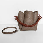 Image of the Tulip Baletti leather handbag in grey and camel. It's behind a white background. The purpose of the image is to highlight the bag because it is for sale at EVAMAIA boutique in Studio City, CA and online.