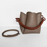 Image of the Tulip Baletti leather handbag in grey and camel. It's behind a white background. The purpose of the image is to highlight the bag because it is for sale at EVAMAIA boutique in Studio City, CA and online.