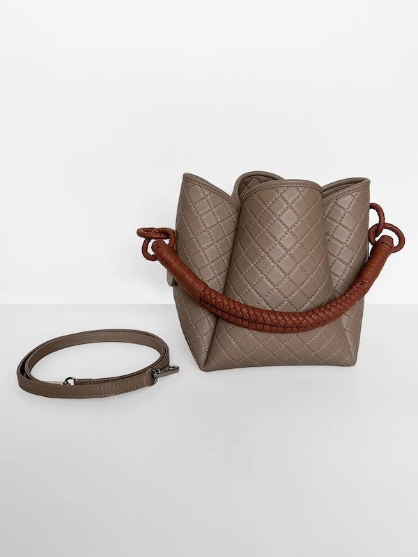 Image of the Tulip Baletti leather handbag in grey and camel. It's behind a white background. The purpose of the image is to highlight the bag because it is for sale at EVAMAIA boutique in Studio City, CA and online.