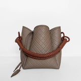Image of the Tulip Baletti leather handbag in grey and camel. It's behind a white background. The purpose of the image is to highlight the bag because it is for sale at EVAMAIA boutique in Studio City, CA and online.