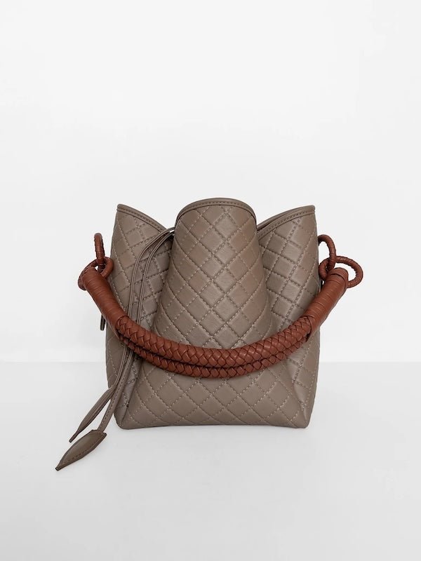 Image of the Tulip Baletti leather handbag in grey and camel. It's behind a white background. The purpose of the image is to highlight the bag because it is for sale at EVAMAIA boutique in Studio City, CA and online.
