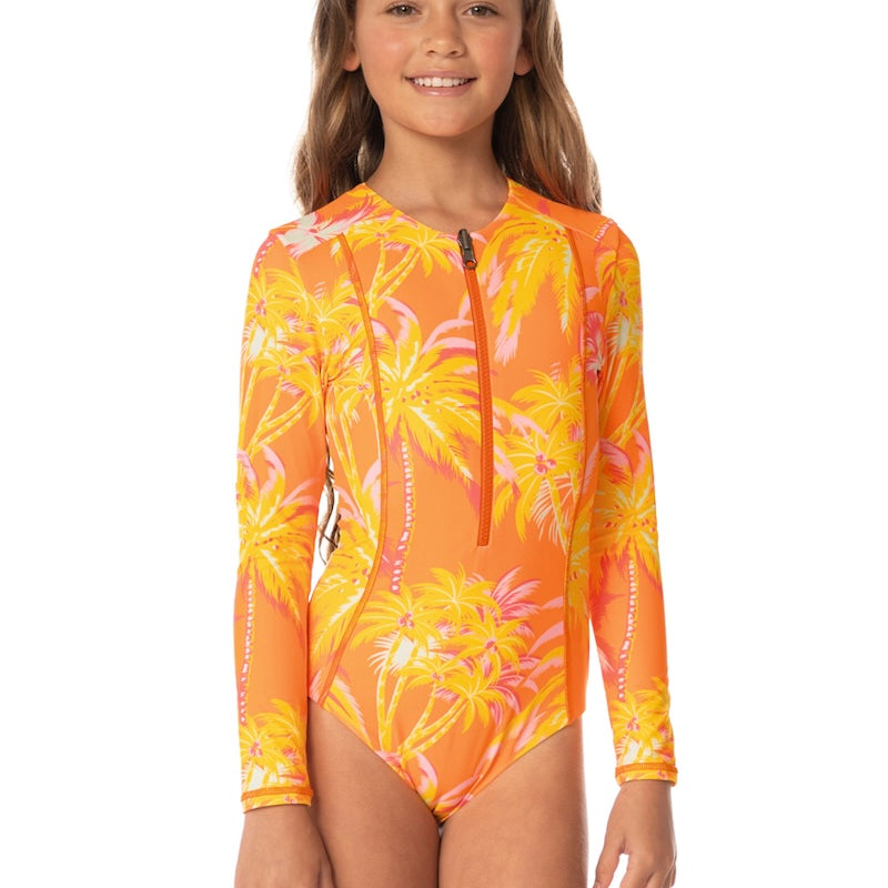 Girl wearing an orange and yellow floral long sleeve swimsuit with long sleeves on a white background 