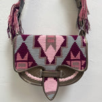 Handbag with geometric pattern on a white background