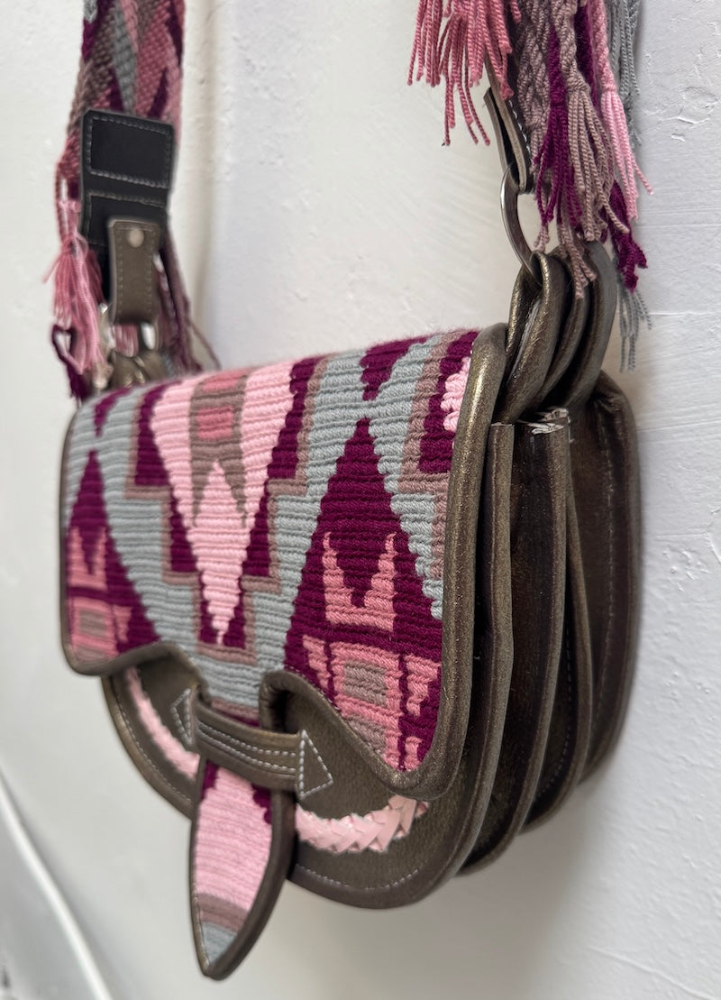 Handbag with geometric pattern on a white background
