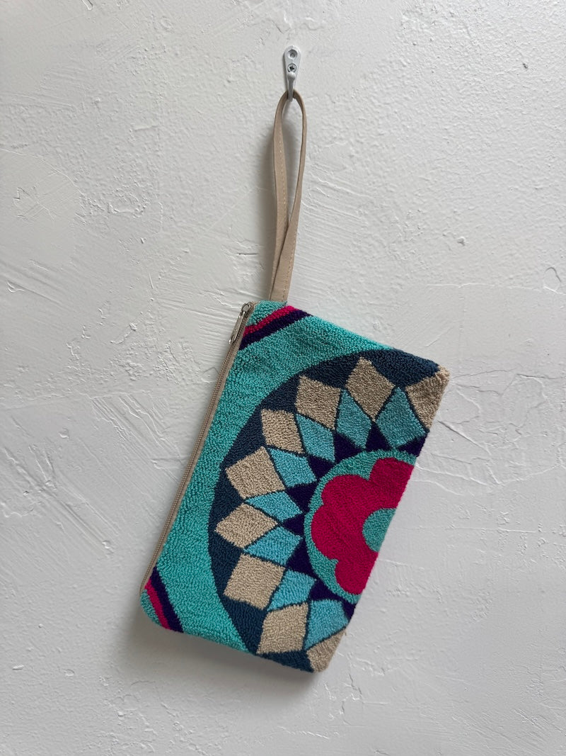 Decorative pouch with geometric pattern on a white background