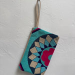 Decorative pouch with geometric pattern on a white background