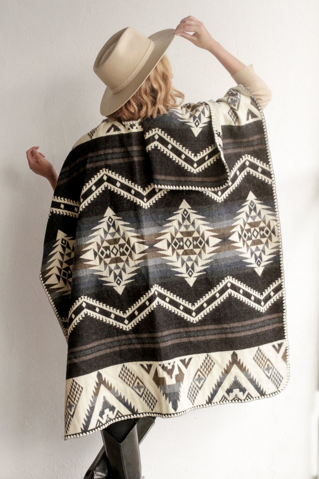 Woman modeling the back of the Arizona Poncho