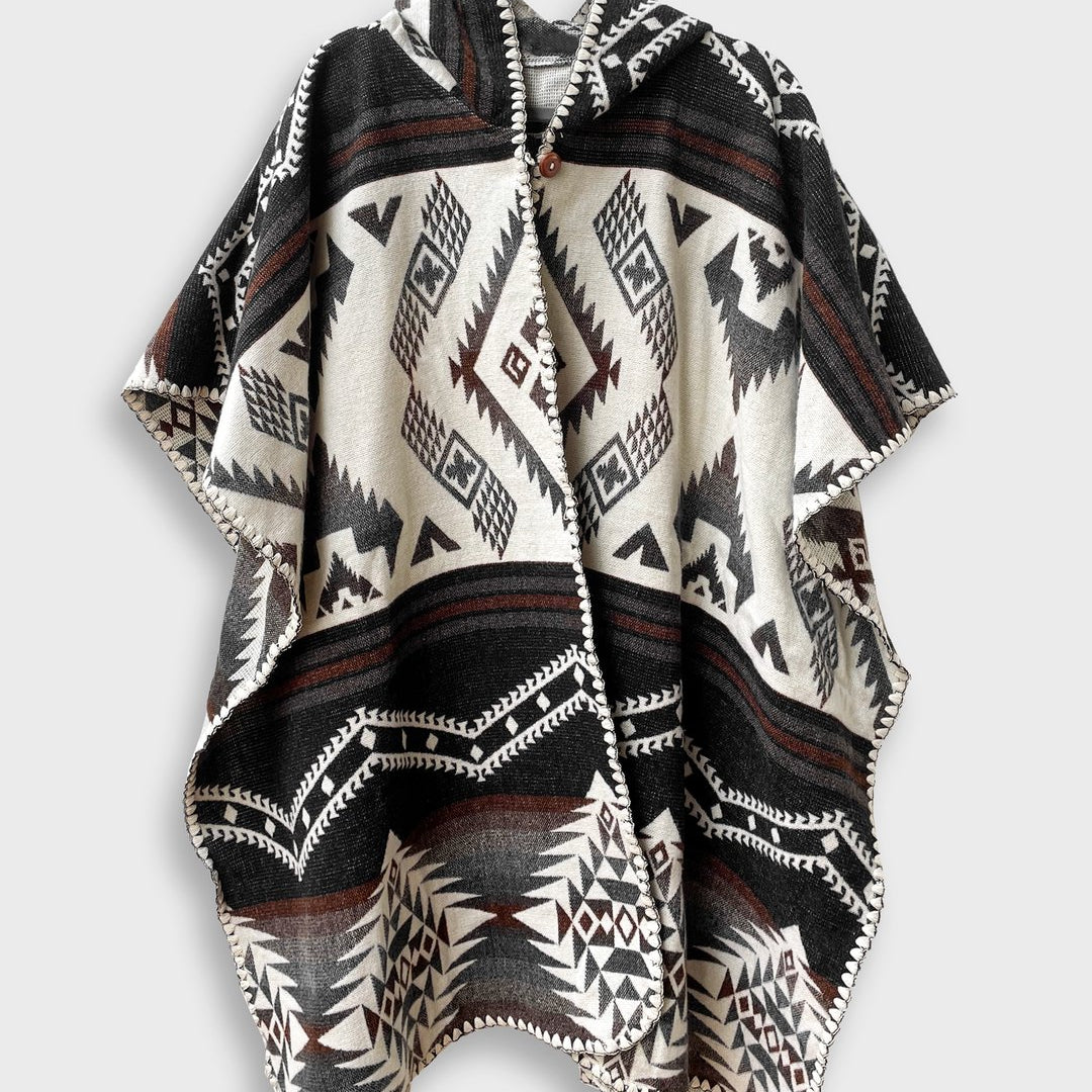 Arizona Poncho with Hood on a plain white background. The Arizona poncho features different brown tones in a full geometric pattern.