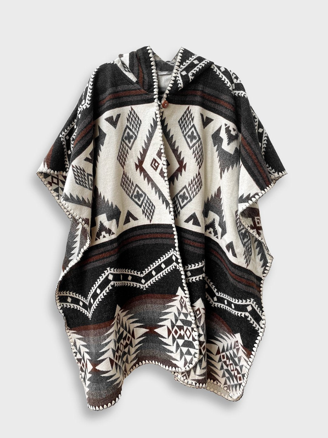 Arizona Poncho with Hood on a plain white background. The Arizona poncho features different brown tones in a full geometric pattern.