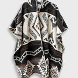 Arizona Poncho with Hood on a plain white background. The Arizona poncho features different brown tones in a full geometric pattern.