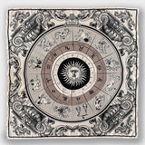 Astro Scarf by Plisse on plain background. A neutral-toned scarf featuring 12 zodiac signs surrounding a radiant sun.