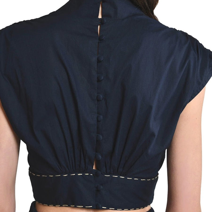 Bea Blouse in Black with embroidered gold stitching around waist, mock neck, with back lined buttons and short sleeves